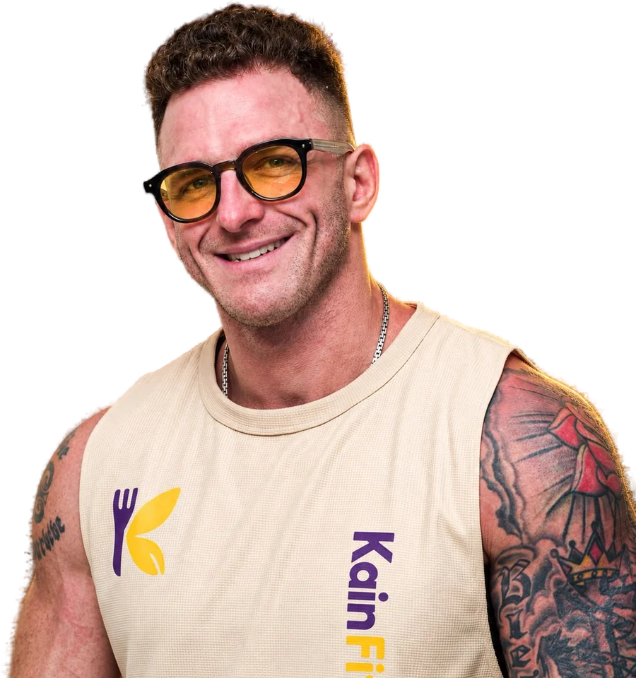 Coach John, smiling, in a KainFit tank top
